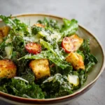 Baby Kale Salad with Lemon Dressing and Parmesan Croutons First Image